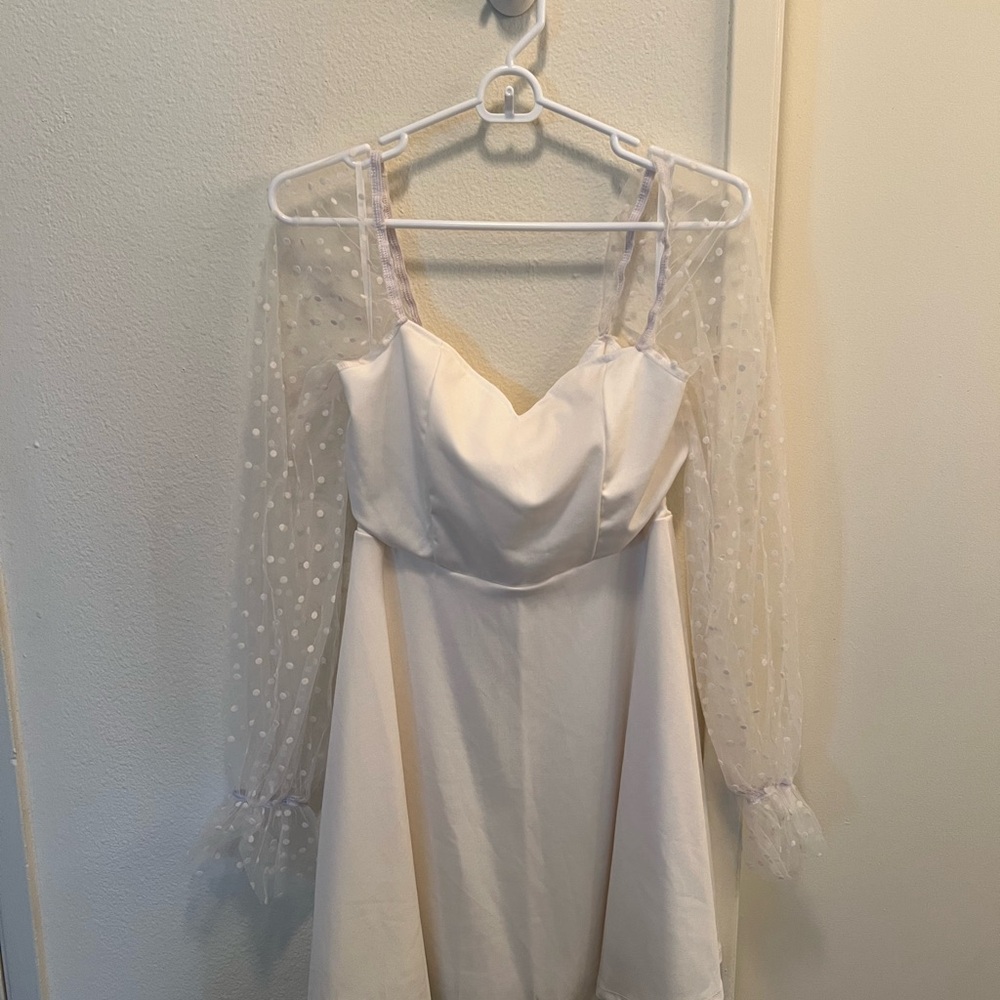 Elegant White Dress with Sheer Polka Dot Sleeves